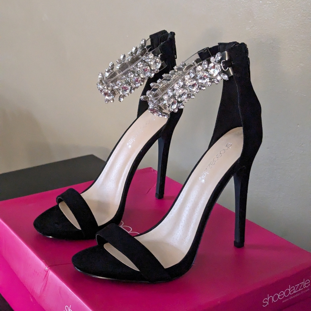 Black high heel with ringstone strap
